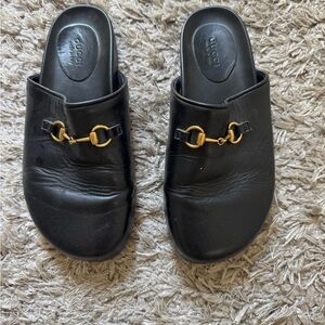 Gucci Black Leather Mules with Gold Accent